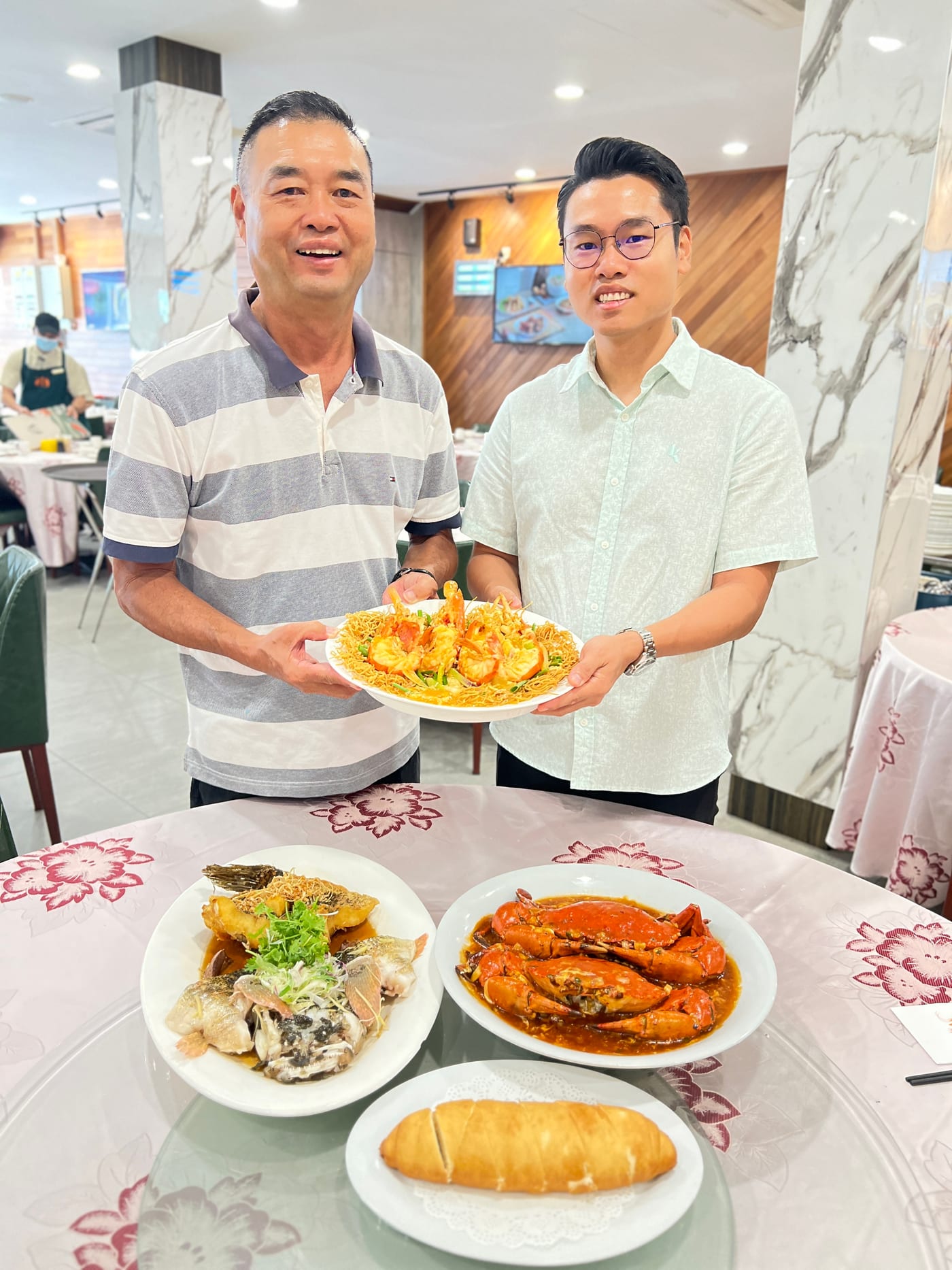 Father and son at Restoran Green View with the signature Sang Har Mee