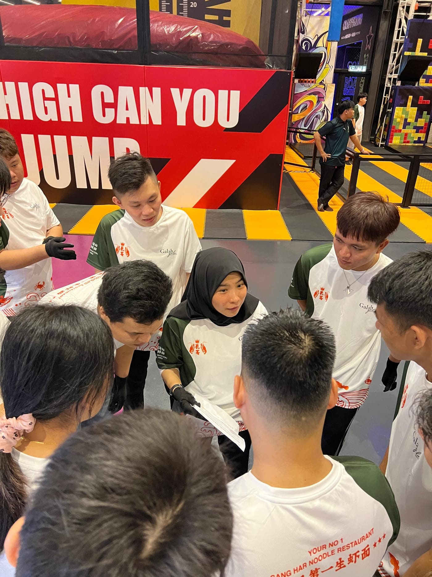 Team huddle before a challenge, 2025 team building